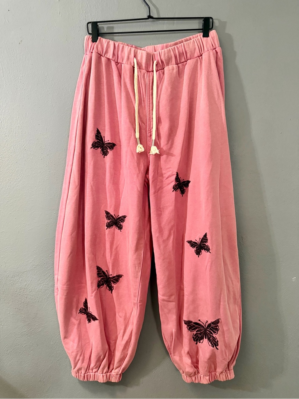 POL Pink Track Joggers with Black Butterfly Motifs
